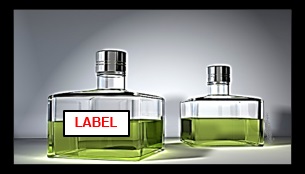 Two colonge bottles sit next to each other, the first has a sticker reading label the second is blank.